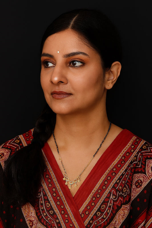 Gold-Plated Black Beads Mangalsutra with Designer Diamond-Shaped Charms