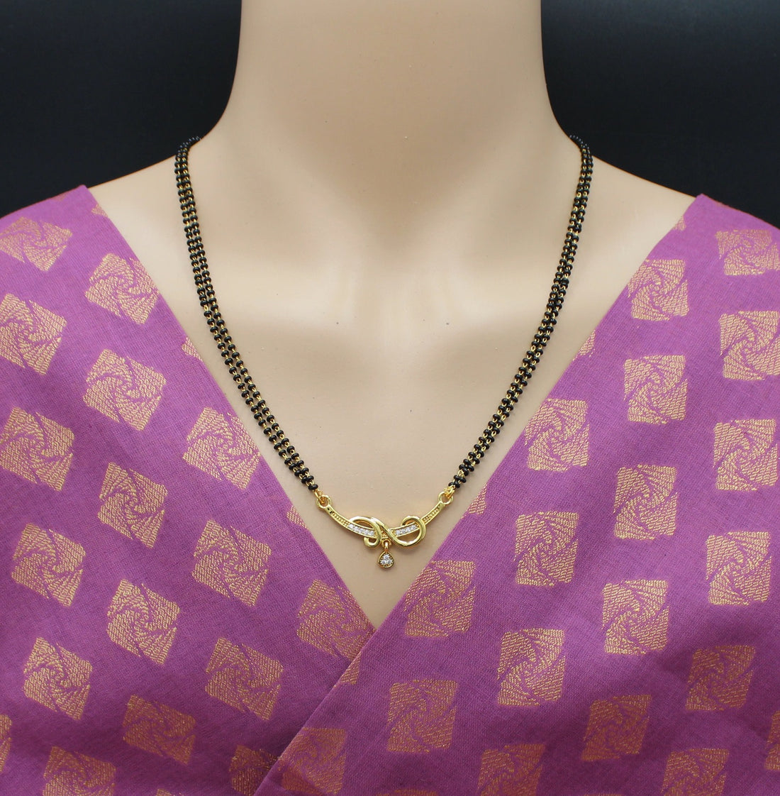 Elegant Double-Line Black Bead Mangalsutra with Golden Spiral Pendant