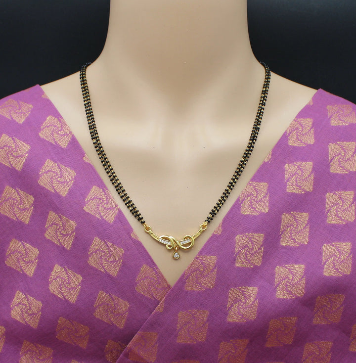 Elegant Double-Line Black Bead Mangalsutra with Golden Spiral Pendant