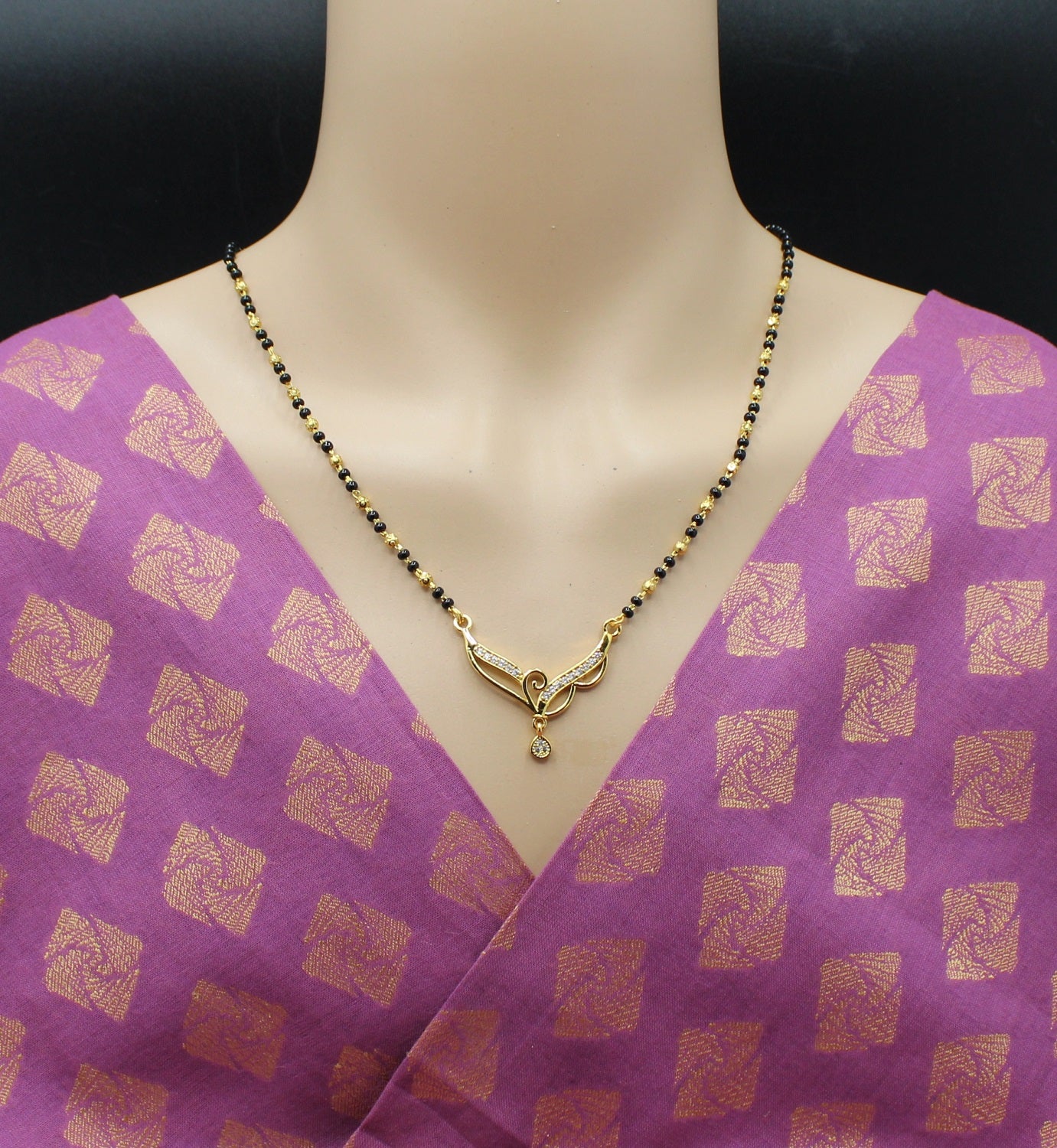 Elegant Black Bead Mangalsutra with Gold-Tone Pendant & CZ Stones