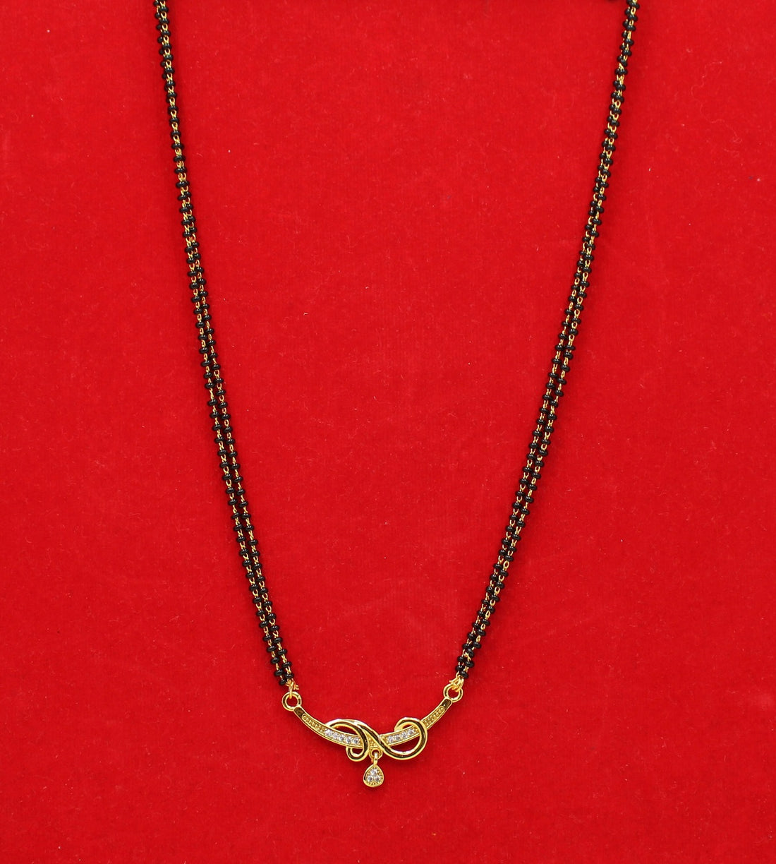 Elegant Double-Line Black Bead Mangalsutra with Golden Spiral Pendant