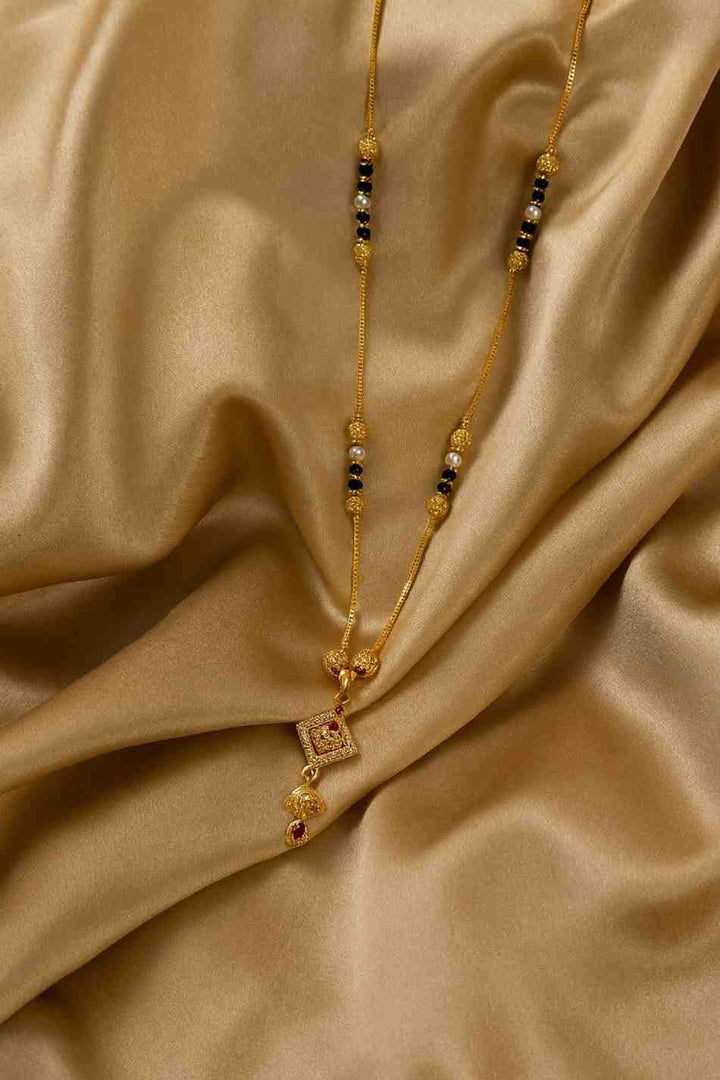 Gold-Plated Traditional Diamond Mangalsutra – Red Stone Pendant with Pearl & Black Beads