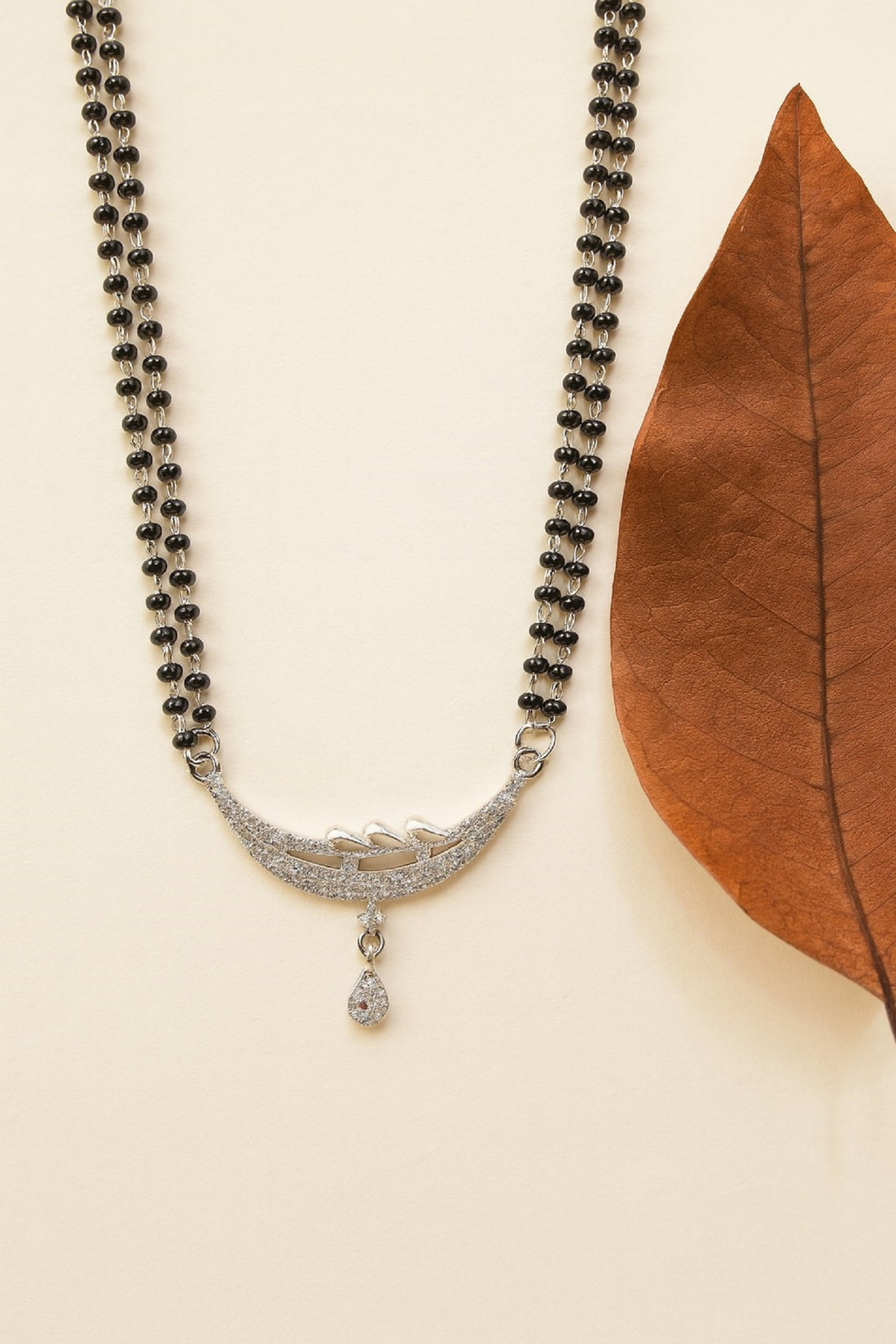 Silver-Plated Double Chain Mangalsutra with CZ Leaf Design & Ruby Drop Pendant – Elegant Daily Wear