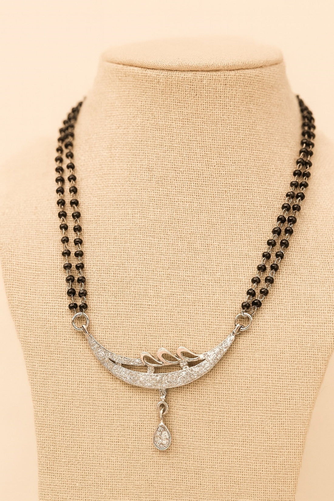 Silver-Plated Double Chain Mangalsutra with CZ Leaf Design & Ruby Drop Pendant – Elegant Daily Wear