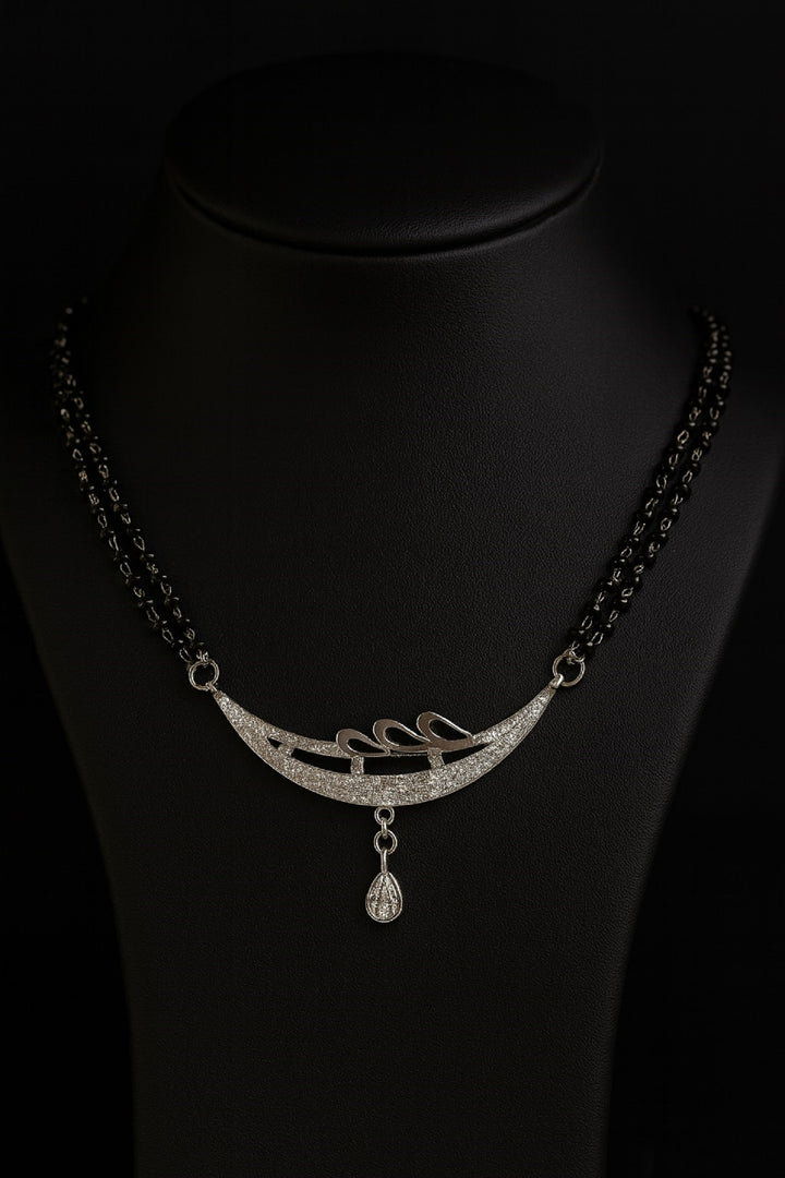 Silver-Plated Double Chain Mangalsutra with CZ Leaf Design & Ruby Drop Pendant – Elegant Daily Wear