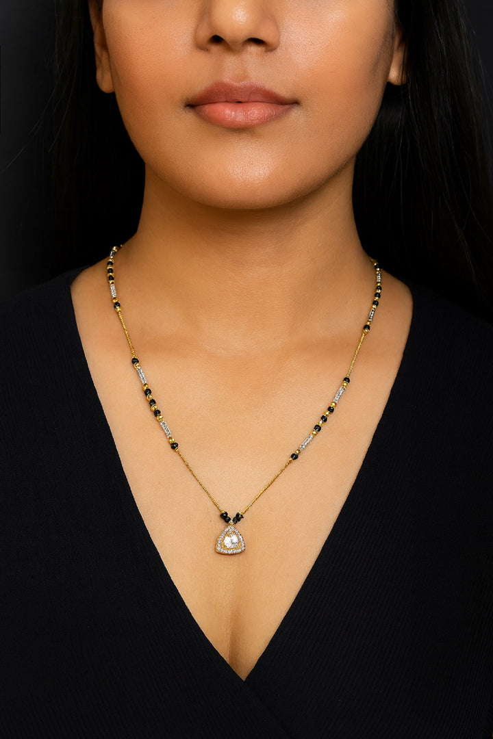 Gold-Plated Mangalsutra with Black Beads & Stone-Studded Triangle Pendant – Elegant Daily Wear