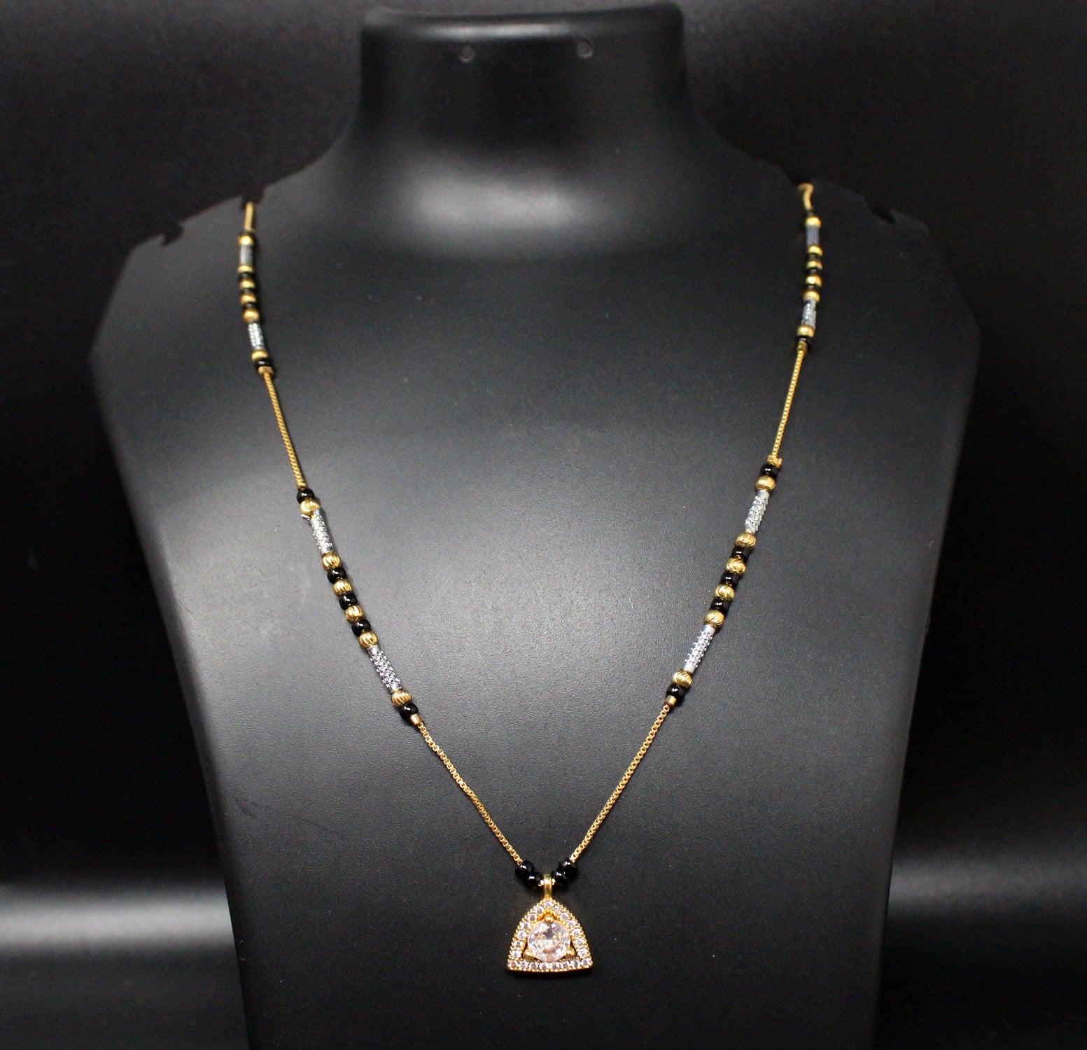 Gold-Plated Mangalsutra with Black Beads & Stone-Studded Triangle Pendant – Elegant Daily Wear