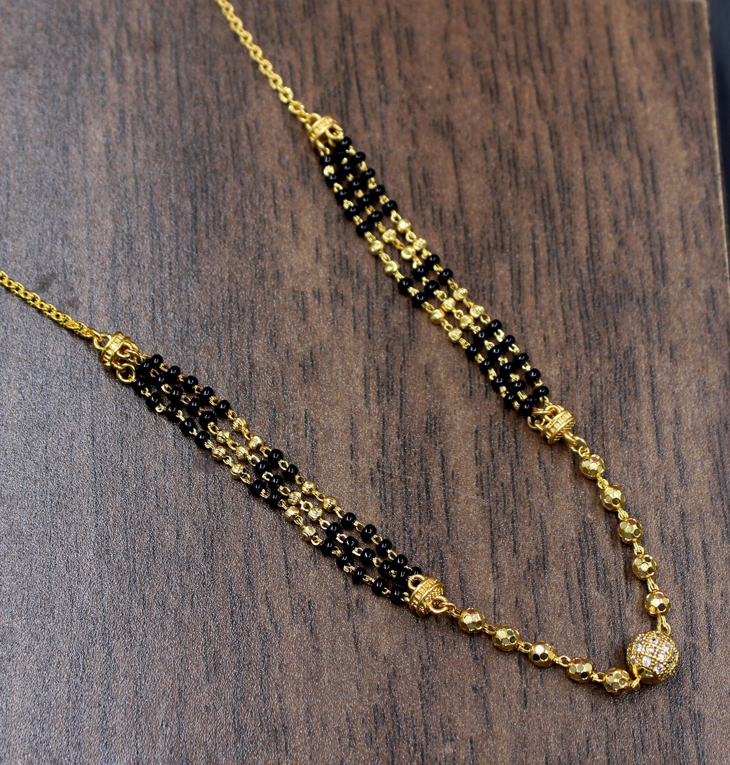 Elegant Dual-Layer Black Bead Gold-Plated Mangalsutra – Modern Grace with Traditional Touch